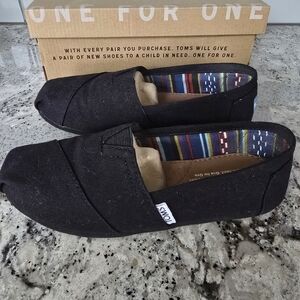 TOMS Black Canvas Slip-Ons